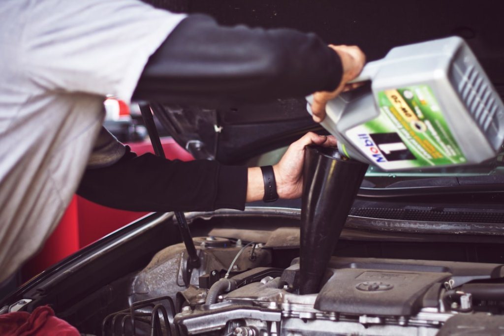 car tune up cost mechanic performing engine tune-up