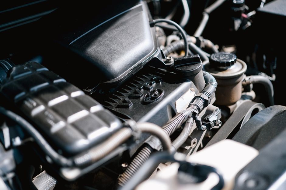 vacuum leak in car engine bay with highlighted vacuum hoses